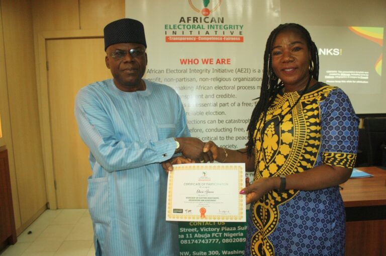Presentation of Certificate of Participation to Mrs. Okoro Ijeoma.