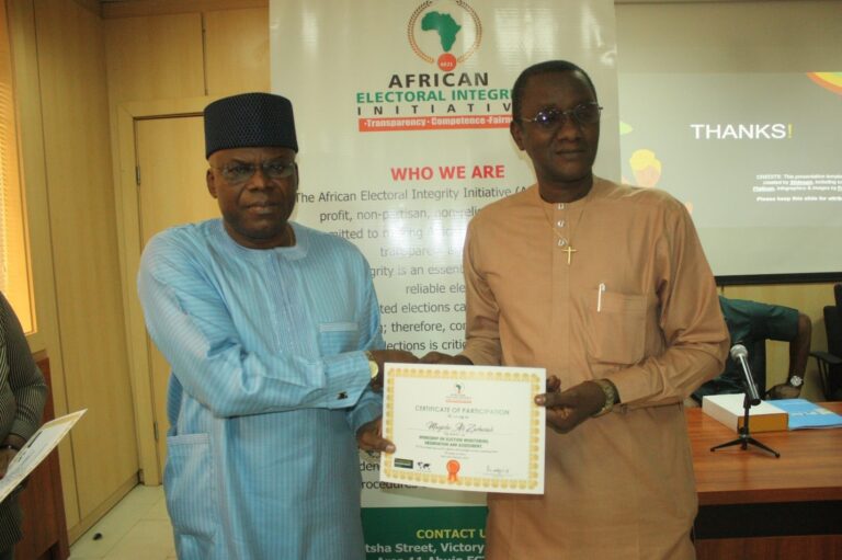 Presentation of Certificate of Participation to Mr. Manjiche Ali Zachariah.