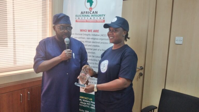 Dr. Daniel Omofoman Executive-Director African Electoral Integrity Initiative presenting an Electoral Integrity Supporter Award to Amb. Ojineme Enakeme who was a speaker at the just concluded workshop on Election Monitoring, Observation and Assessment