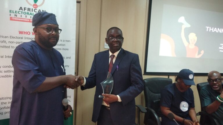 Dr. Daniel Omofoman Executive-Director African Electoral Integrity Initiative presenting an Electoral Integrity Supporter Award to Dr. Davidson Aminu who was a speaker at the just concluded workshop on Election Monitoring, Observation and Assessment.