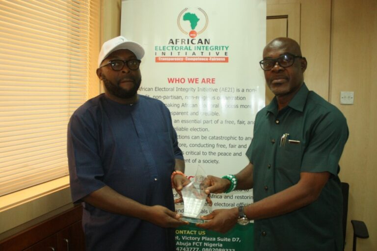 Dr. Daniel Omofoman Executive-Director African Electoral Integrity Initiative presenting an Electoral Integrity Supporter Award to Mr. Chris Agiri who was a speaker at the just concluded workshop on Election Monitoring, Observation and Assessment.