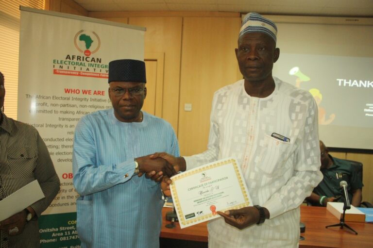 Presentation of Certificate of Participation to Mr. Nasambo J.U